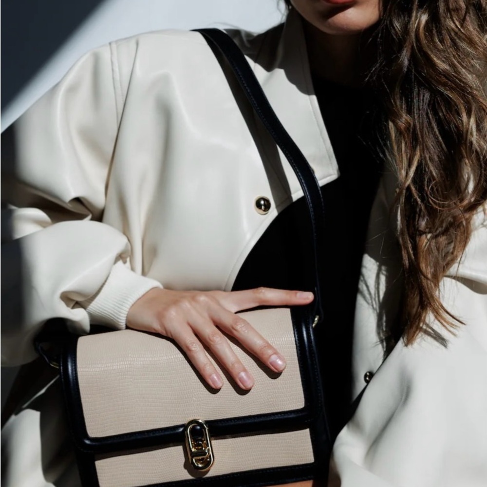 Elegant Jules Kae Cream and Black Shoulder Bag